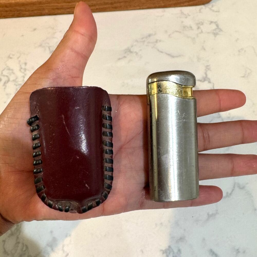 vintage butane lighter mid-20th century w/ burgundy leather sleeve case
